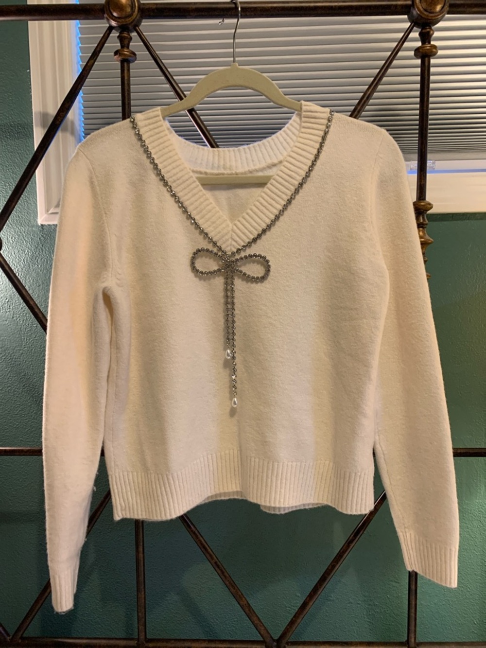 LOFT Cream V-Neck Sweater with Decorative Bow Chain
